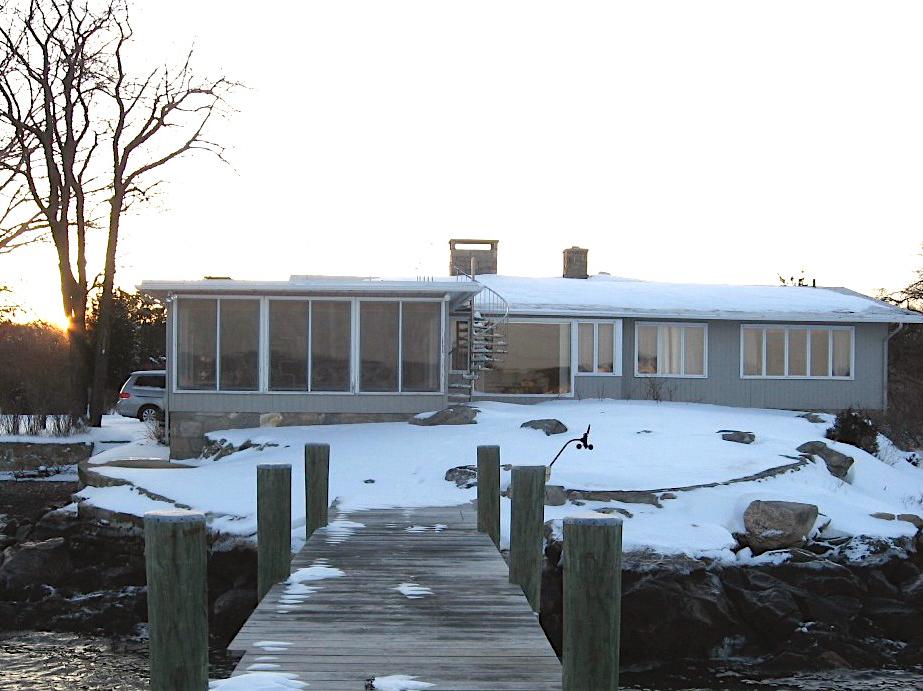 The house from the dock on a winter evening