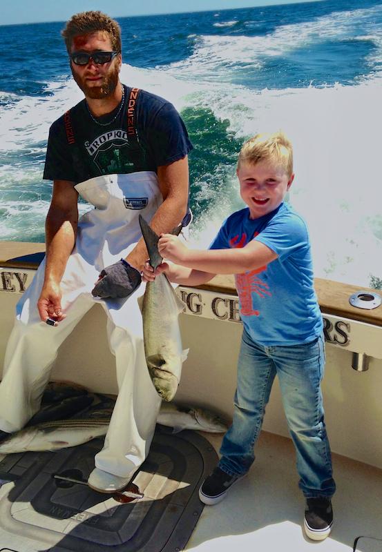 A good day on a fishing charter: bluefish coming over the rail.