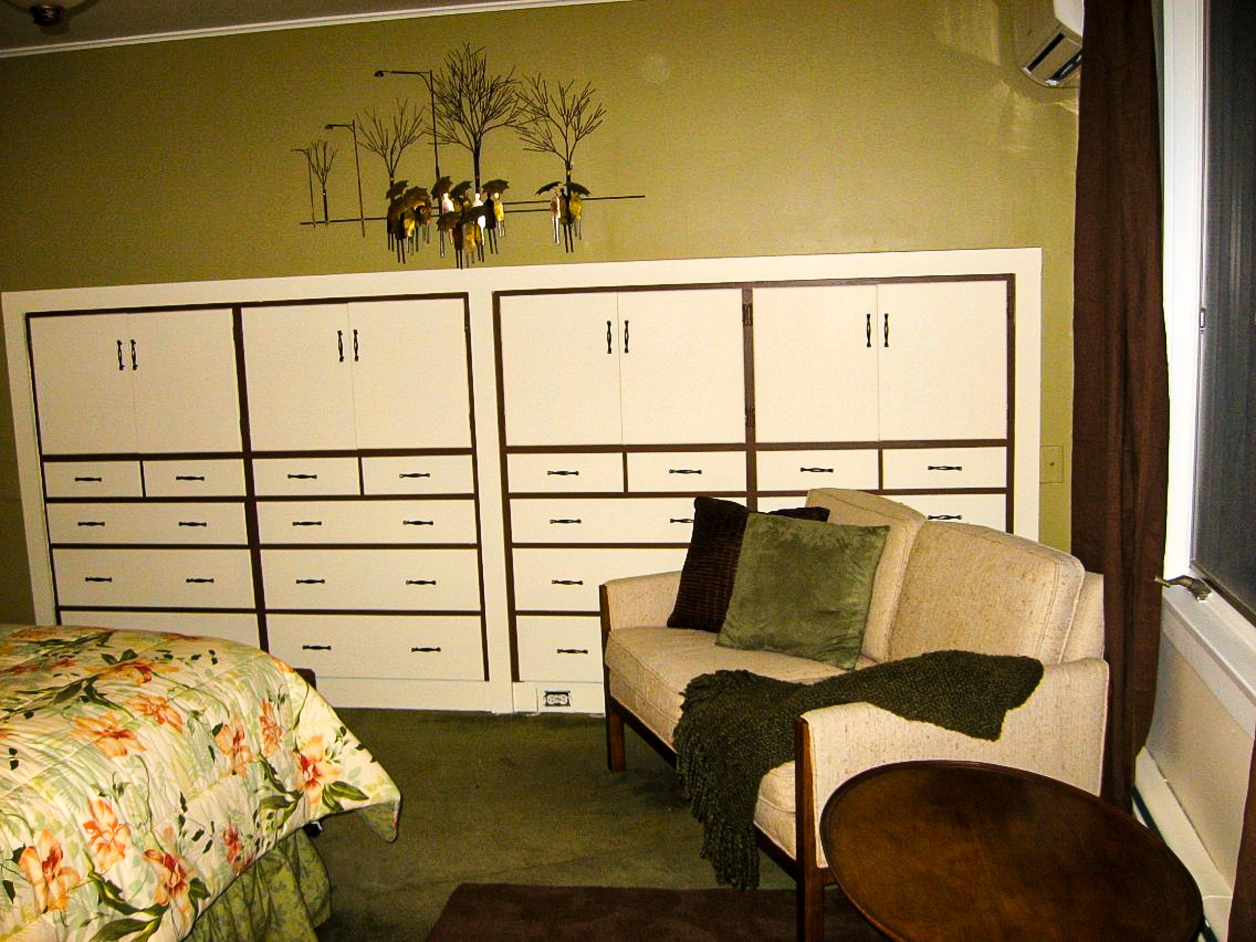 The master: the wall of built-ins and the sitting corner.